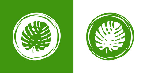 Logo paraíso tropical. Dibujo sencillo de la silueta de una hoja de planta tropical monstera en un círculo con líneas en el borde, en blanco y verde © teracreonte