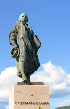 LAVAGNA, ITALY &ndash; MAY 8, 2026: Bronze statue of the explorer Christopher Columbus on a bright spring day with blue sky and white cumulus clouds