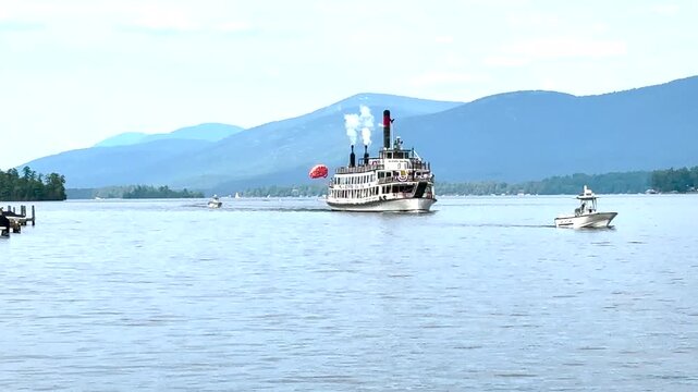 A steamboat moves across Lake George in New York.