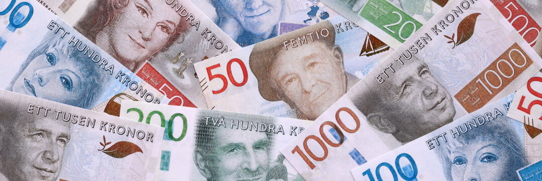 Swedish krona money bills pile on table. Sweden banknotes of SEK currency close up.