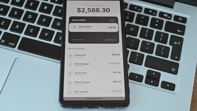 Digital banking app interface showing money balance and transaction history on a mobile phone screen.