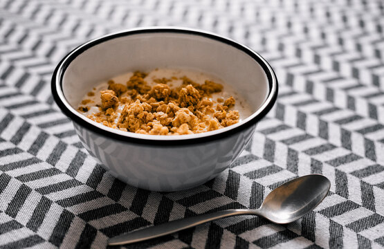 Bowl of crunchy muesli with natural yoghurt