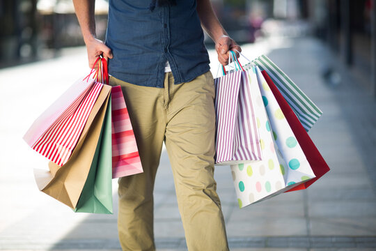 Man carrying lots of shopping bags
