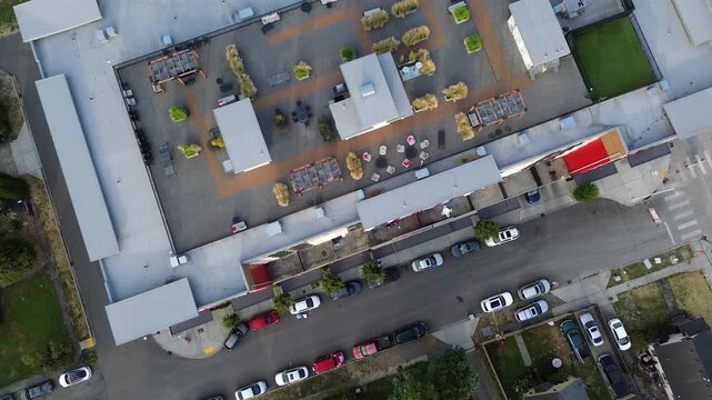 Elevated green spaces offer recreational functionality atop commercial buildings near downtown Kent. Sustainable design elements improve property value across developing districts located in WA