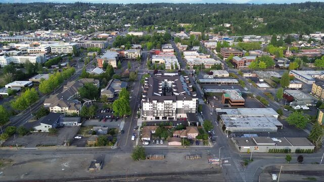 Urban rooftop decks feature modular seating and wooden walkways near downtown Kent, suburbs Seattle. Outdoor living spaces enhance multi family residential properties located throughout WA