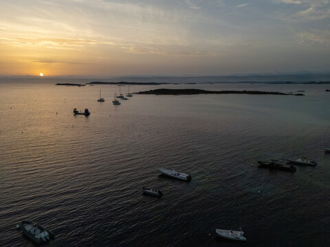 Boats anchoring in Piantarella lagoon during sunset