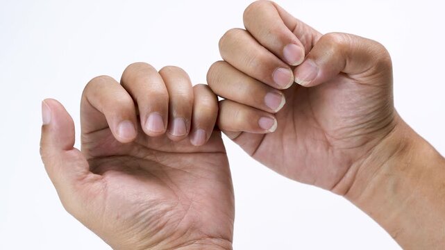 Close up of clean natural fingernails on human hands, highlighting personal hygiene, nail health, self care, grooming, wellness, healthy lifestyle, skincare, and everyday cleanliness.