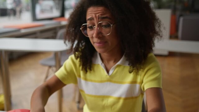 Irritated stressed African American woman student girl typing laptop fail lost connection unsaved online document test difficulty female studying learning with computer sad with problem in high school