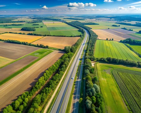 Aerial view of a highway going through agricultural fields in Belogorye, Voronezh region
