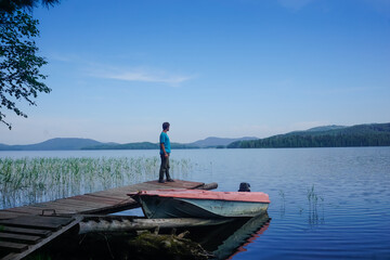 Naklejka premium A traveler looks into the distance at Lake Tiberkul