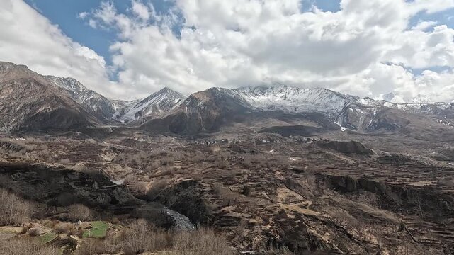 Wide shot from Jhong over Ranipauwa valley with Annapurna and Tilicho, Mustang, Nepal