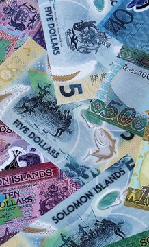 Solomon Islands dollar money bills in pile. Big amount of Solomon Islands SBD currency cash close up