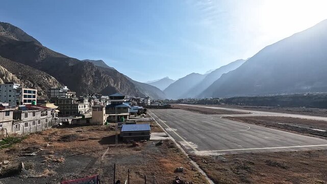 Jomsom airport runway village snow peaks valley Mustang Nepal mountains aerial view