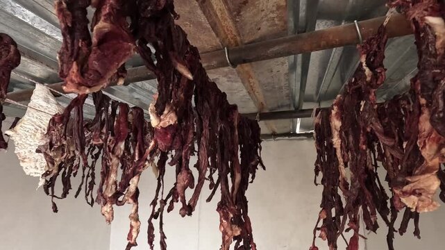 Drying yak meat hanging ceiling rafters traditional preservation Lo Manthang Upper Mustang Nepal