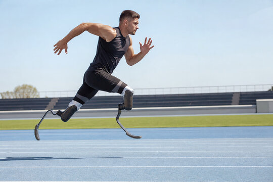 Paralympic sprinter racing on running blades outdoors