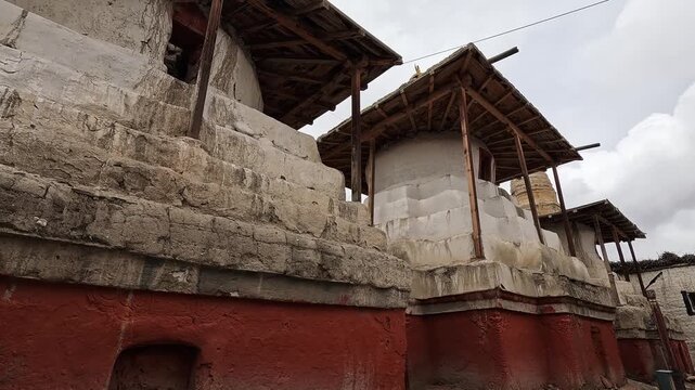 Whitewashed chorten wooden shelters red base Lo Manthang Upper Mustang Nepal Buddhist
