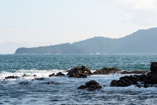 Rocky headlands and rocks are struck by powerful waves that crash with energy. Angra dos Reis &ndash; Rio de Janeiro, Brazil.