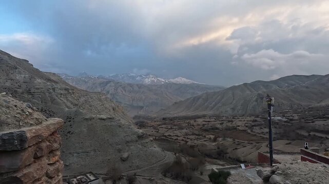 Panoramic wide valley mountains snowy peaks road Lo Manthang Upper Mustang Nepal