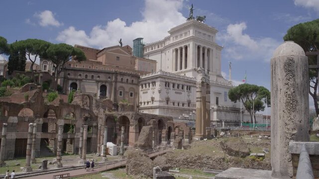 Roman Forum Ruins With Victor Emmanuel II Monument in Background Rome Italy Summer Historic Landmark View Shot with Cinema Camera