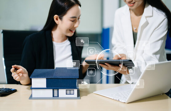 Asian real estate consultants using digital PropTech technology, smart property tools and tablet for home investment, mortgage planning and modern business.
