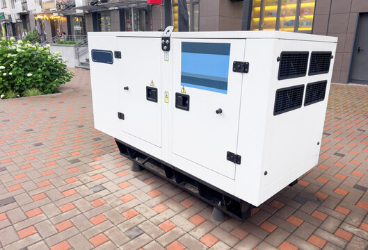 Industrial standby diesel generator installed outdoors near commercial building backup power equipment