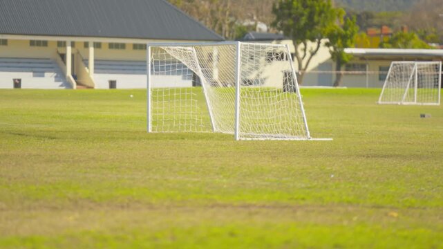 Football Goal Posts on a a football field.