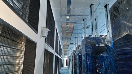 Naklejka premium Newly Constructed Data Center Server Room with IT Racks and Overhead Cable Tray Installation