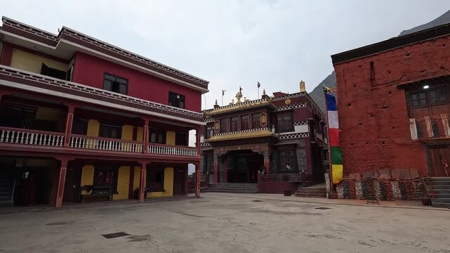 Kag Chode monastery courtyard with decorated buildings, traditional Tibetan architecture Nepal