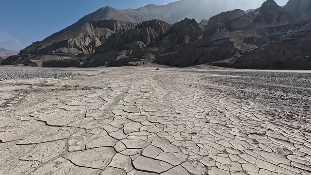 Cracked dry clay riverbed Kali Gandaki, polygon mud patterns, desert landscape, Mustang Nepal