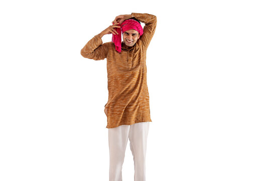Portrait of a farmer tying cloth on his head