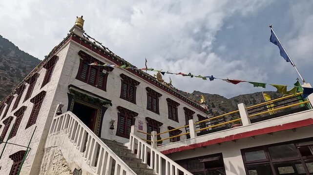 Samten Choling Gompa monastery ornate roof, prayer flags, Marpha Mustang Nepal