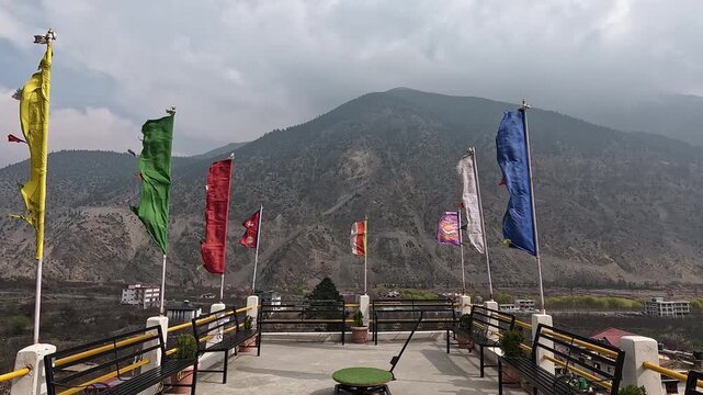 Viewing platform prayer flags, benches, mountain valley Samten Choling Gompa Marpha