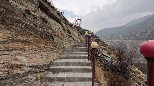 Stone staircase with colorful prayer flag decorations, valley view Marpha Mustang
