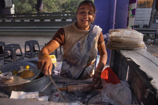 Portrait of a senior woman cooking at her roadside food stall