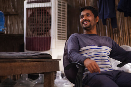 Rickshaw puller resting  in his hut