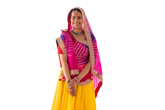 Portrait of Rajasthani woman standing against white background
