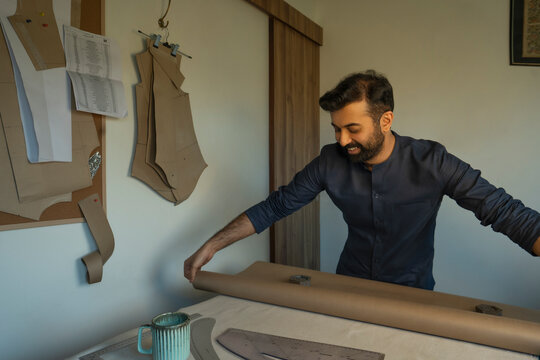A male designer making patterns in his studio 