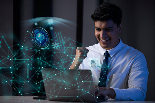 Businessman working on laptop computer with icons on virtual screen
