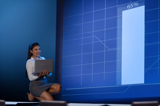 Technician/programmer holding a laptop in the server/data  room