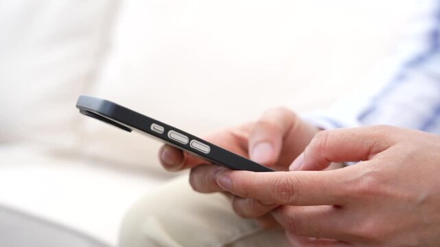 Person using smartphone beside laptop for email communication, Business productivity, Online workflow, Mobile connectivity. Digital communication, Remote work, Information access, Technology concept