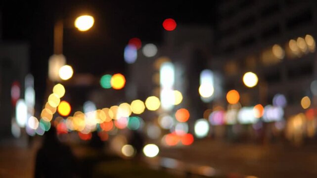 Urban Night Street Lights Bokeh Moving Through Busy City Setting