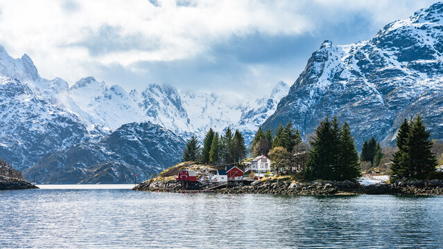 Landscape with snow-covered mountains in the Trollfjord in Norway on a cloudy day