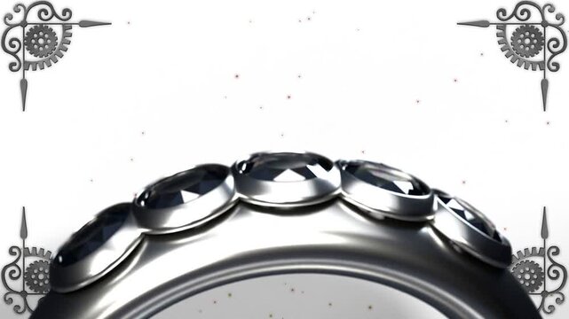 Silver ring rotating on camera pullback, revealing gems and filigree corners showcasing metalwork