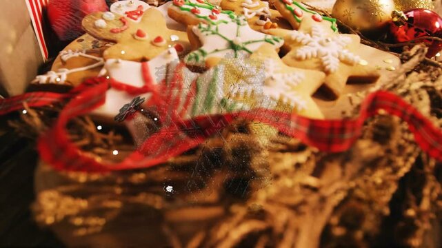 Cam pulling back tilting, showing cookies while snow drifting, evoking cozy close-up