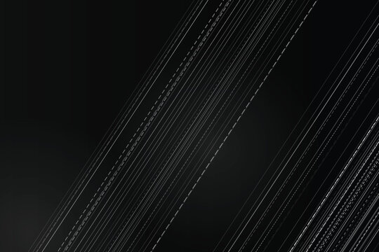 Diagonal white dashed lines on black abstract background, texture