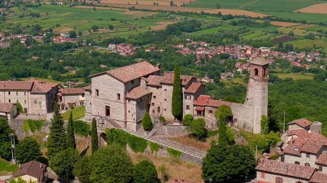 Greccio Italy Aerial Drone Flight Over Medieval Village Rooftops and Bell Tower Reveal Scenic Green Valley of Rieti Lazio Traditional Borgo Authentic Architecture Travel Footage 4K 70mm