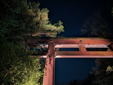 Illuminated Torii gate of a Shinto shrine at night in Sendai, Miyagi, Japan.