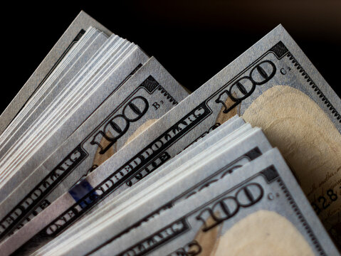 Stacks of Hundred Dollar Bills with Close-Up Focus