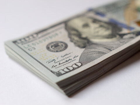 Stack of Hundred Dollar Bills on Table