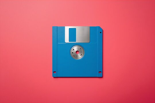 Blue floppy disk on a bright pink background with technology computer magnetic background software hardware electronic information computing obsolete portable diskette innovation platform